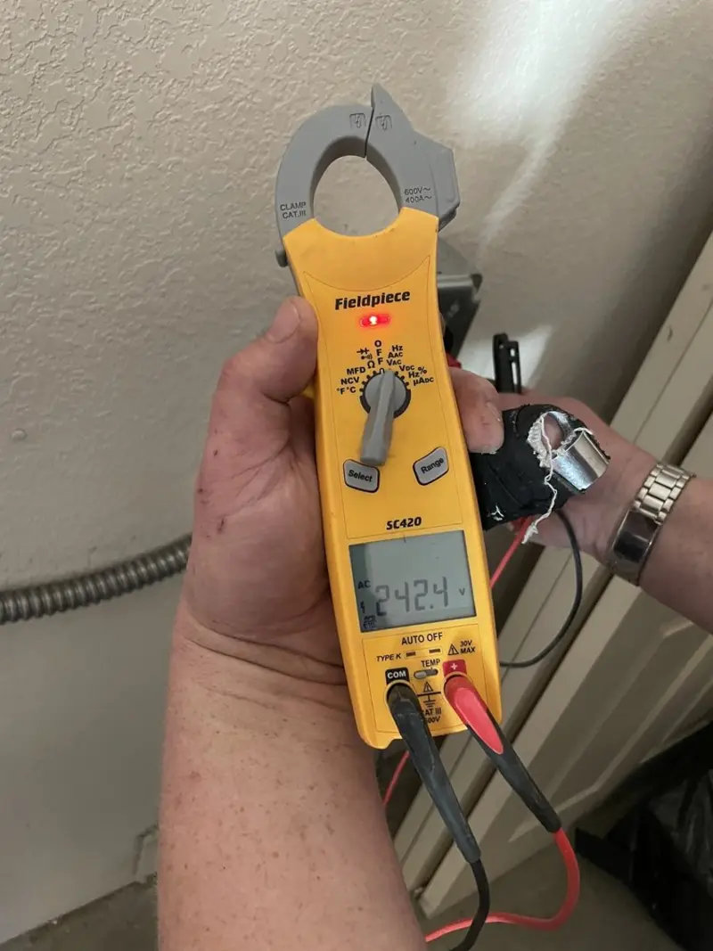 Voltage testing with clamp meter during Circuit Breaker Repair in Highland Falls